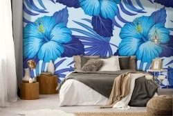 Blue tropical leaves and flowers wallpaper.