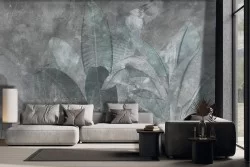 Carta da parati foglie tropicali grandi su sfondo cemento