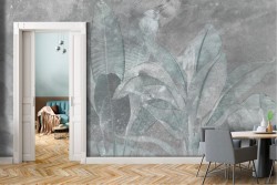 Adhesive Wallpaper with large tropical leaves on a concrete background