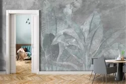 Adhesive Wallpaper with large tropical leaves on a concrete background