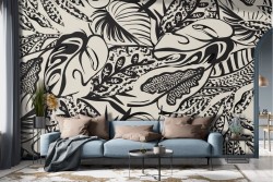 Graffiti effect wallpaper with black tropical leaves