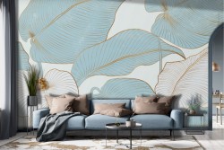 Stylized tropical leaves wallpaper in gold and azure
