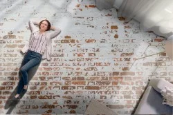 Damaged baked bricks wallpaper surface