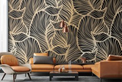 Wallpaper with large stylized tropical gold leaves.